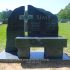 sims religious cross headstone with black marble bench