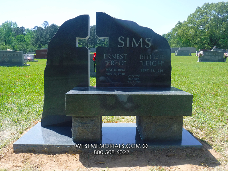 sims religious cross headstone with black marble bench