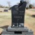 cowboy hat tree trunk black gravestone